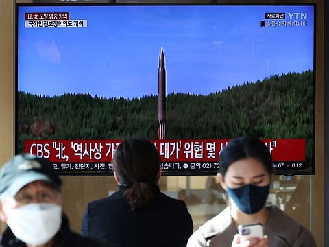 People watch a TV broadcasting a news report on North Korea firing a ballistic missile off its east coast, in Seoul, South Korea, November 2, 2022.