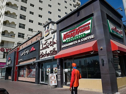 Pizza Hut and Krispy Kreme outlets, operated by Americana, at Buhaira Corniche in Sharjah.