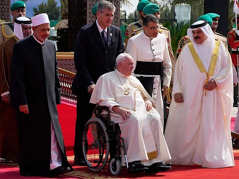 Pope Francis, flanked by Ahmed Al-Tayeb, Grand Imam of al-Azhar, and Bahrain's King Hamad Bin Eisa Al Khalifa as they attend the closing session of the "Bahrain Forum for Dialogue: East and west for Human Coexistence", at the Al-Fida square at the Sakhir Royal palace, Bahrain, Friday, Nov. 4, 2022