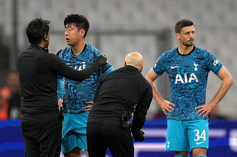 Tottenham's Son Heung-min receives treatment after taking a knock during the Champions League Group D match against Marseille.