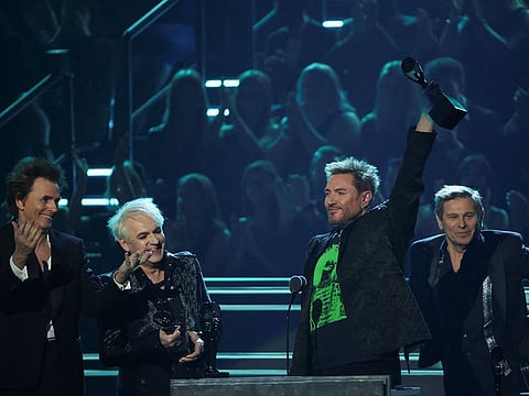 Inductees John Taylor, Nick Rhodes, Simon Le Bon, and Roger Taylor of Duran Duran gesture on stage at the 37th Annual Rock & Roll Hall of Fame Induction Ceremony in Los Angeles, California.