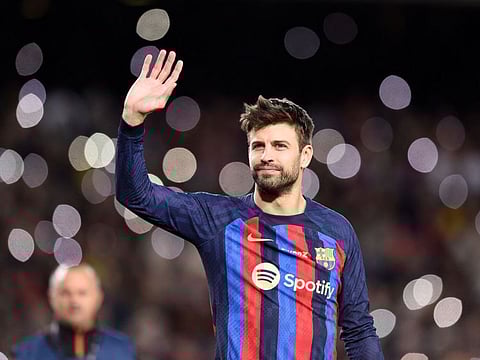 Barcelona's Spanish defender Gerard Pique waves at the end of the Spanish league football match between FC Barcelona and UD Almeria at the Camp Nou stadium in Barcelona. Pique played his last match as he announced his retirement after stellar career.