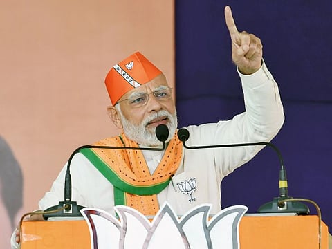 Narendra Modi addresses a public meeting ahead of the Gujarat Assembly elections, at Nana Pondha, Kaprada, in Valsad on Sunday.