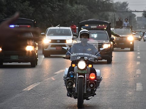 Vehicles escort former Prime Minister Imran Khan, who was wounded after a shooting incident on a long march in Wazirabad, heading to his residence after being discharged from Shaukat Khanum Memorial Cancer Hospital & Research Centre, in Lahore, Pakistan November 6, 2022.