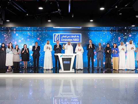 Hesham Abdulla Al Qassim, Vice Chairman and Managing Director of Emirates NBD, rings the bell at Nasdaq Dubai.
