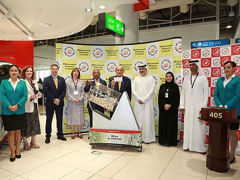 Dubai Duty Free officials with the winning ticket for the million-dollar draw at Terminal 2 of Dubai International Airport