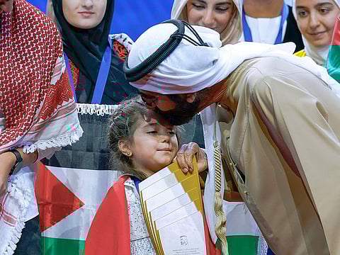 Archive image of His Highness Sheikh Mohammed bin Rashid Al Maktoum, Vice President and Prime Minister of the UAE and Ruler of Dubai, with the 2022 Arab Reading Challenge champion Sham Al Bakour in Dubai