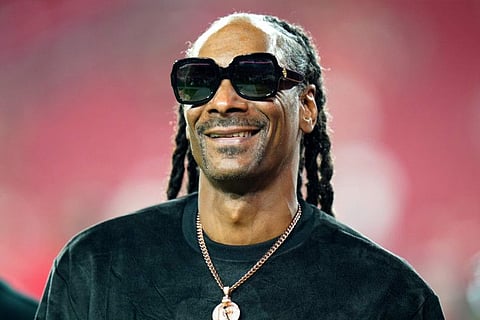 Entertainer Snoop Dogg walks on the field before an NFL football game between the Tampa Bay Buccaneers and the New Orleans Saints Sunday, Dec. 19, 2021.