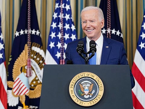 US President Joe Biden smiles as he wrings up a post-election press conference a day after the US midterm elections, in the State Dining Room of the White House in Washington, DC, on November 9, 2022.