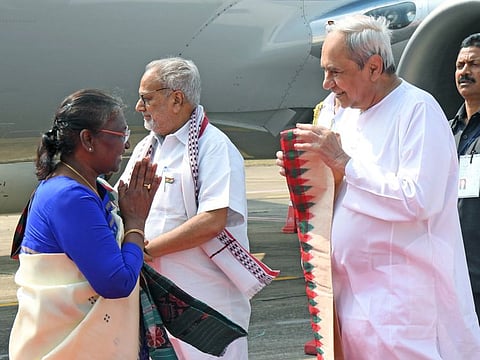 President Droupadi Murmu being welcomed by Odisha Odisha Chief Minister Naveen Patnaik upon her arrival, as state Governor Ganeshi Lal looks on, in Bhubaneswar on Thursday.