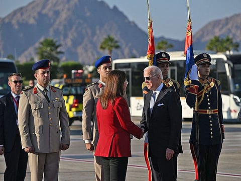 US President Joe Biden is greeted upon his arrival at the airport of Egypt's Red Sea resort city of Sharm Al Sheikh, to attend the COP27 climate conference, on November 11, 2022.