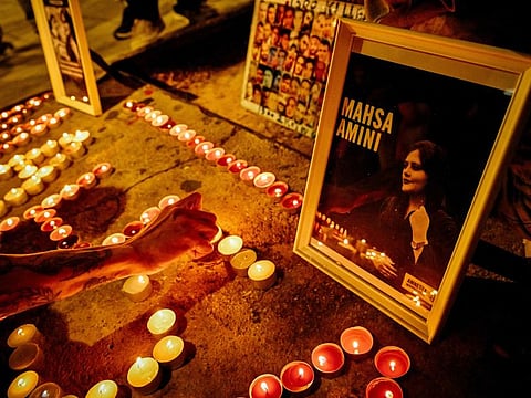 Iranian refugees and Iranians living in Greece lit candles forming the name 'Mahsa' during a demonstration to commemorate 40 days from the death of Iranian Mahsa Amini while in police custody, in central Athens.