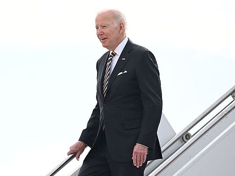 US President Joe Biden disembarks from Air Force One upon arrival in Cambodia's Phnom Penh International Airport.