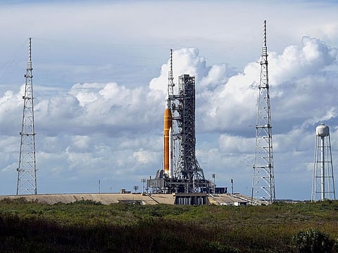 NASA's next-generation moon rocket, the Space Launch System (SLS) rocket with its Orion crew capsule perched on top, stands at launch complex 39-B