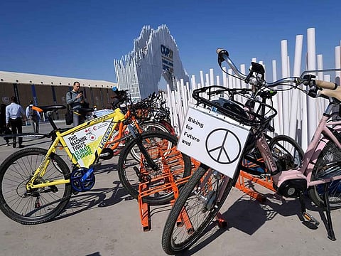 The bike of Dorothee Hildebrandt, 72, is parked at the COP27 UN Climate Summit, Saturday, November 12, 2022, in Sharm Al Sheikh, Egypt. Hildebrandt biked from Sweden to Sharm Al Sheikh, Egypt, for COP27 to raise awareness and urge world leaders gathered at the conference to take concrete steps to stop climate change.