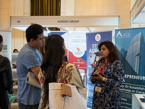 Visitors exploring immigration opportunities at GNICE 2022