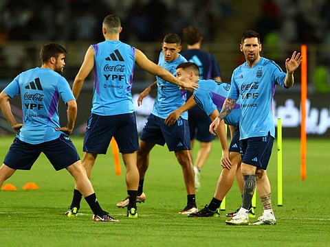 Argentina's Lionel Messi (right) with his teammates during training at Al Nahyan Stadium, Abu Dhabi.