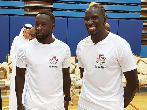 Bacary Sanya (left) with Mamadou Sakho at Al Nasr Club during a charity match to raise money for underprivileged children.