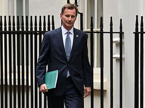 Britain's Chancellor of the Exchequer Jeremy Hunt leaves Downing Street in central London on his way to make a full budget statement in the House of Commons on November 17, 2022