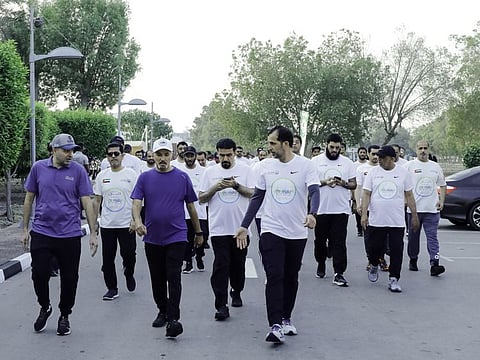 Dubai Police Commander-in-Chief Lieutenant General Abdullah Khalifa Al Marri and other senior officials during the walk as part of the Dubai Fitness Challenge activity.