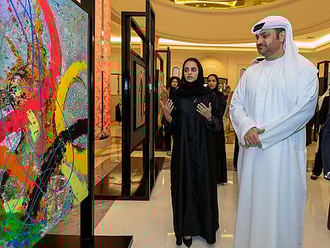 Mahmood Alhashmi, director-general of Ajman Department of Tourism Development, tours the exhibition