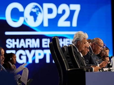 Sameh Shoukry, president of the COP27 climate summit, right, speaks during a closing plenary session at the U.N. Climate Summit.