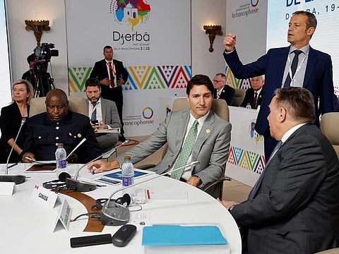 Burundi's President Evariste Ndayishimiye (L), Canada's Prime Minister Justin Trudeau (C), and Quebec Prime Minister Francois Legault (R-down) attend a working session during a bilateral meeting at the 18th Francophone countries Summit in Djerba, on November 19, 2022.