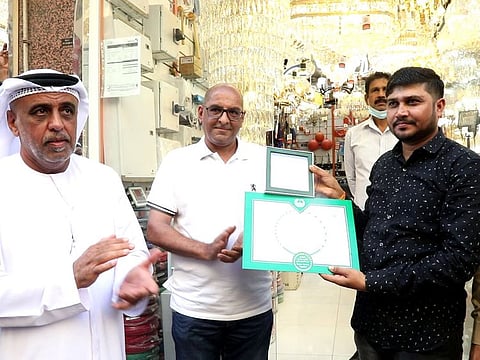 Indian expat Keshur Kara Chavada Karu Ghela being honoured by Dubai Police officials in Dubai.