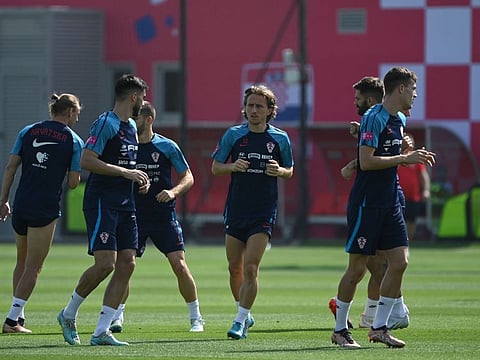 Croatia's midfielder Luka Modric (centre) and his teammates take part a training session at the team's Al Ersal training camp in Doha.