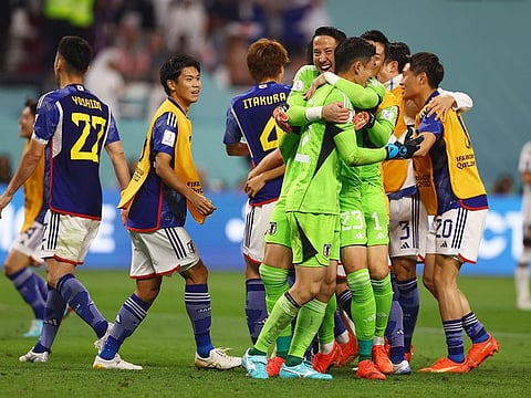 Japan's Shuichi Gonda celebrates with teammates after the match.
