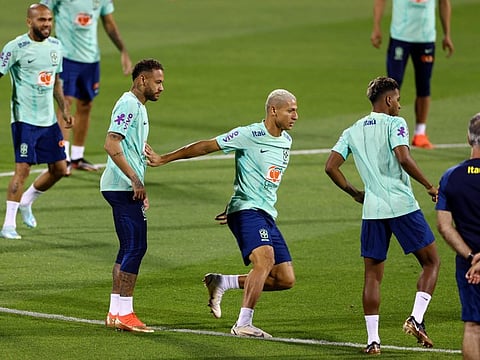Brazil's Neymar (centre left) and Richarlison (centre right) during training at Al Arabi SC Stadium, Doha, Qatar.