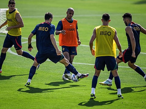 Portugal's midfielder Joao Mario (centre) takes part with his teammates in a training session at Shahaniya Sports Club of Al Samriya Autograph Collection Hotel in Al Samriya, northwest of Doha.