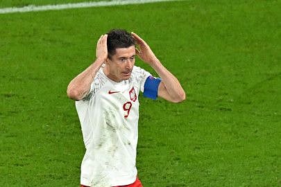 Poland's forward Robert Lewandowski reacts after Mexico's goalkeeper Guillermo Ochoa stopped his penalty kick during the Qatar 2022 World Cup Group C at Stadium 974 in Doha.