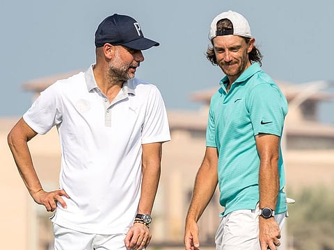 Manchester City manager Pep Guardiola and Tommy Fleetwood during the Pro-Am at Saadiyat Beach Golf Club on Wednesday.