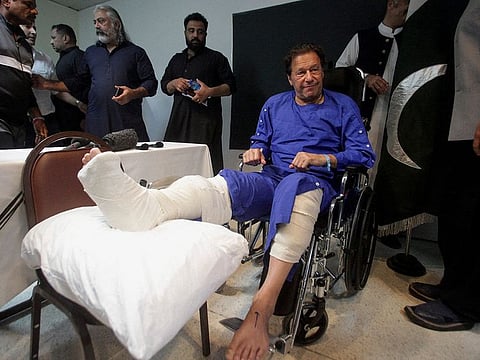 Imran at a hospital after he was injured by a gunman.