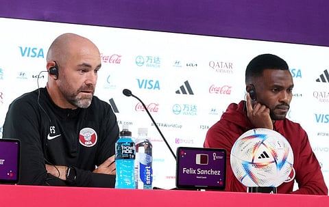 Qatar coach Felix Sanchez (left) and defender  Ismail Mohammed attend a press conference at the Qatar National Convention Center in Doha on Thursday.