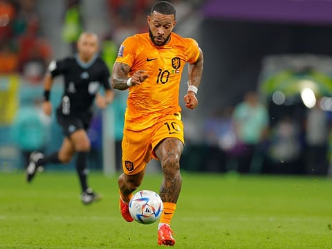 Netherlands' forward Memphis Depay runs with the ball during the Qatar 2022 World Cup Group A match against Senegal.