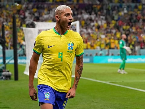 Brazil's Richarlison celebrates after scoring during the World Cup group G match against Serbia, at the Lusail Stadium in Lusail, Qatar.