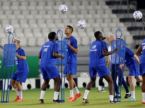 France's Raphael Varane trains along with other teammates at Al Sadd SC Stadium in Doha.