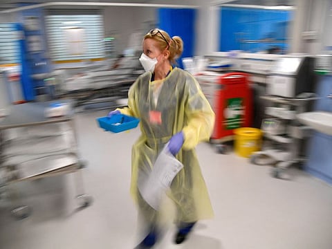 A nurse treats COVID-19 patients in the ICU (Intensive Care Unit) at Milton Keynes University Hospital in Milton Keynes, Britain, in a file photo.