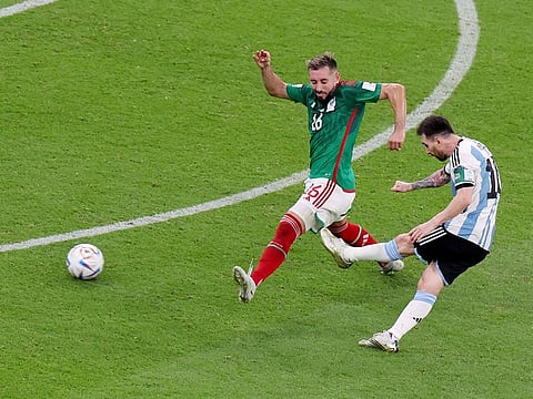 Argentina's Lionel Messi scores their first goal during their World Cup group C match against Mexico, at the Lusail Stadium in Lusail, Qatar, on Saturday, November 26, 2022.