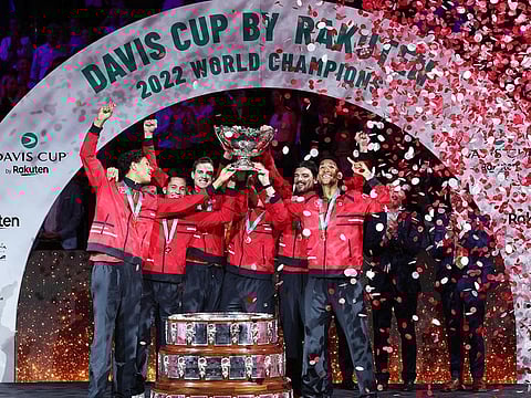 Canada's team holds the trophy after winning the Davis Cup tennis tournament at the Martin Carpena sportshall, in Malaga on November 27, 2022.