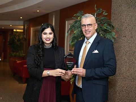 Ned Baltagi of SANS Institute receiving the award from Kausar Syed of CPI Media Group