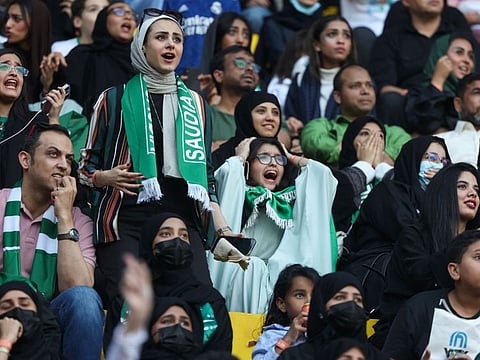 Saudi football fans react as they watch the Qatar 2022 World Cup Group C match between Poland and Saudi Arabia, in the capital Riyadh.