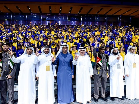 Abdulrahman Al Awar, Minister of Human Resources and Emiratisation, Major General Mohamed Ahmed Al Marri, General Director of Residency and Foreigners Affairs, Major General Obaid Muhair Bin Suroor, Chairman of the awards and Deputy Director General of GDRFA and guests taking a photo with workers at the 5th Cycle of Taqdeer Award. Photo: Virendra Saklani/Gulf News