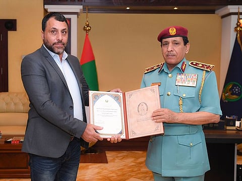 Hisham Benlhaj (left) being honoured by Major General Ali Abdullah bin Alwan Al Nuaimi, Commander-in-Chief of Ras Al Khaimah Police
