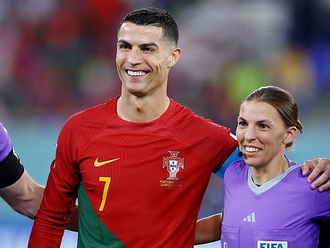 Portugal's Cristiano Ronaldo poses with Stephanie Frappart. Frappart will become the first woman to take charge of a men’s World Cup game when she handles Germany vs. Costa Rica on Thursday in Qatar.