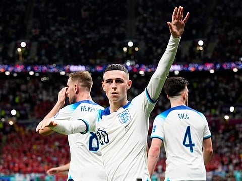 Star man... England's Phil Foden waves to the fans after scoring his side's second goal during the World Cup group B match against Wales, at the Ahmad Bin Ali Stadium in Al Rayyan, Qatar.