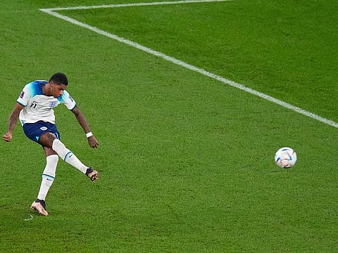 England's Marcus Rashford scores his side's first goal during the World Cup group B soccer match between England and Wales, at the Ahmad Bin Ali Stadium in Al Rayyan , Qatar, Tuesday, Nov. 29, 2022.