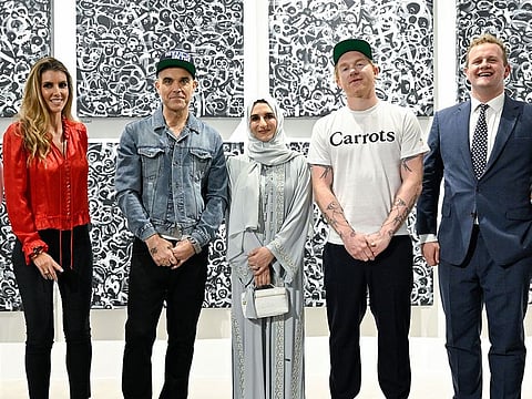 Robbie Williams (second left) and Ed Godrich (second right).